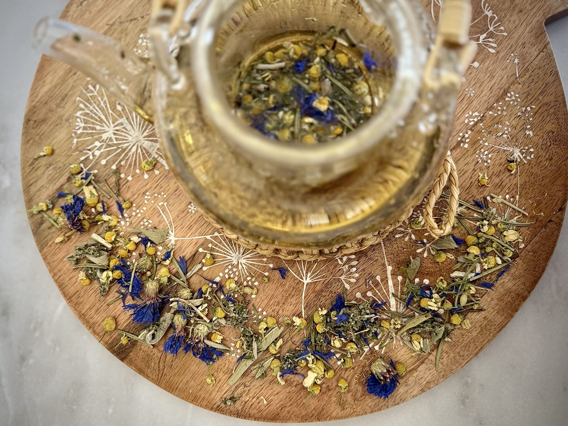 clear tea cup on brown surface